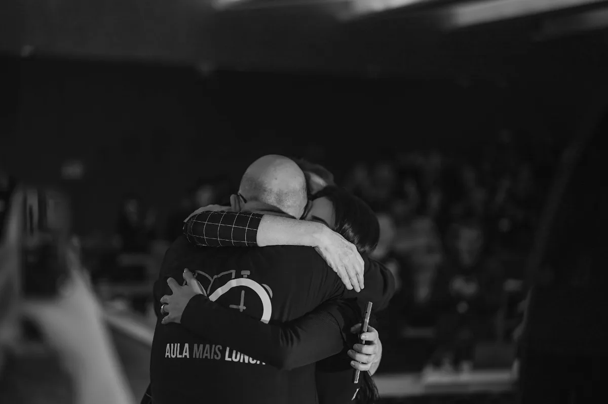 The founders embracing at the close of the 82 hours
